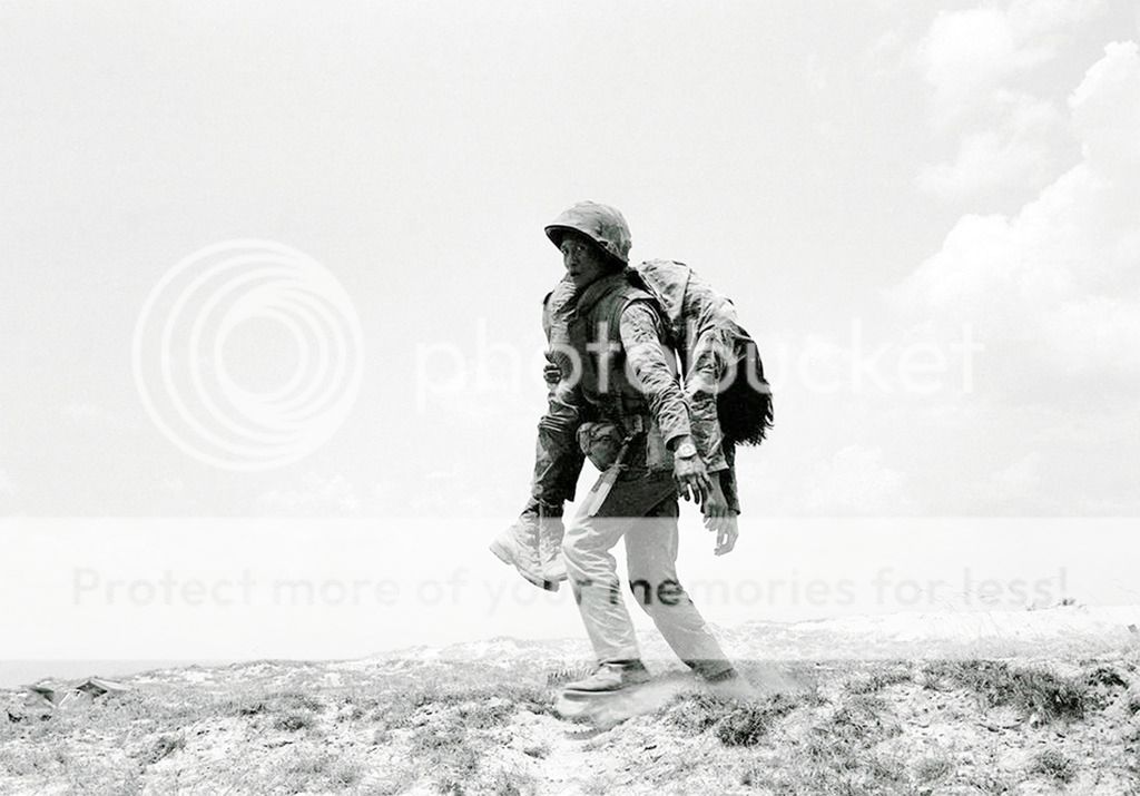  photo A South Vietnamese Marine carries the dead body of a comrade killed on Route 1 April 30 1972_zpstqgd49le.jpg